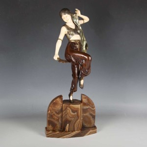 AN ART DECO CAST BRONZE AND IVORY FIGURE